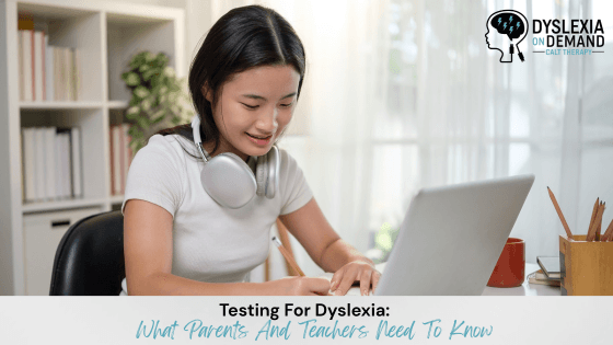 A young woman with headphones around her neck smiles while working on a laptop at a desk. The image features the Dyslexia On Demand logo and highlights Testing For Dyslexia: What Parents And Teachers Need To Know.